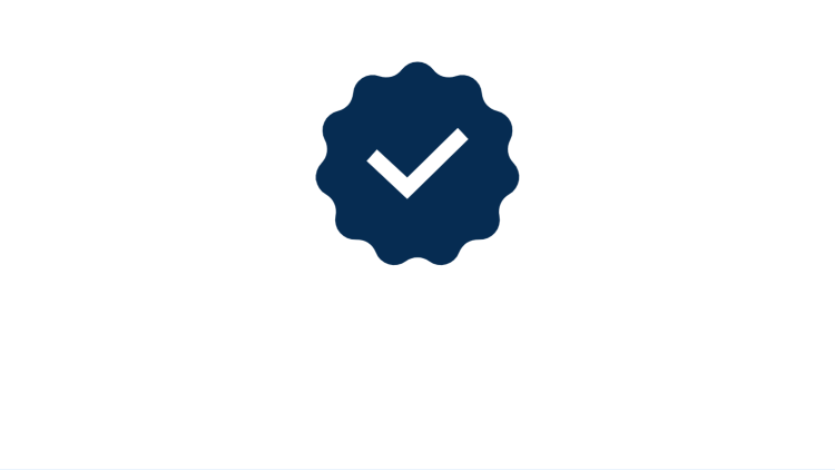 Clip art of circular badge with a check mark. Links to tax professionals page.